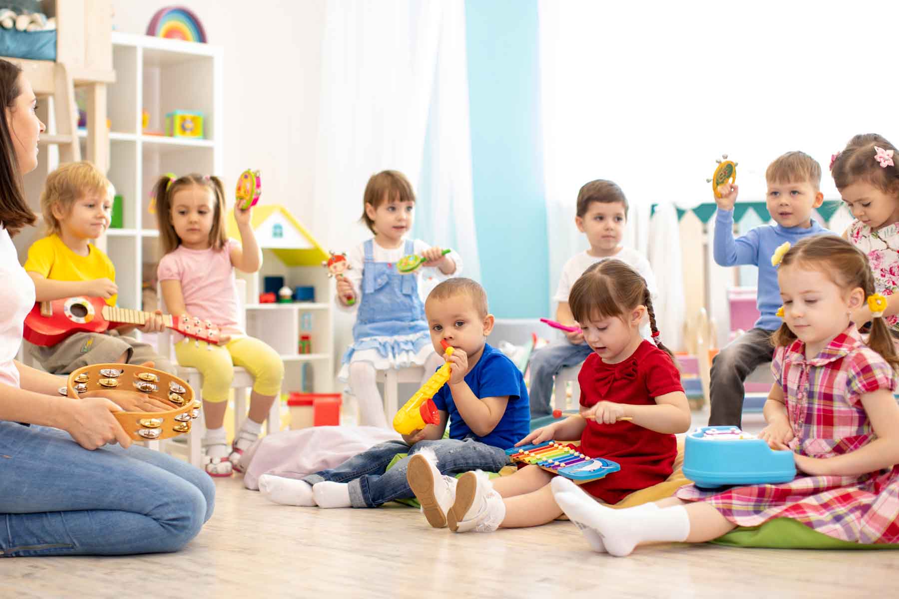 Children playing musical instruments in preschool