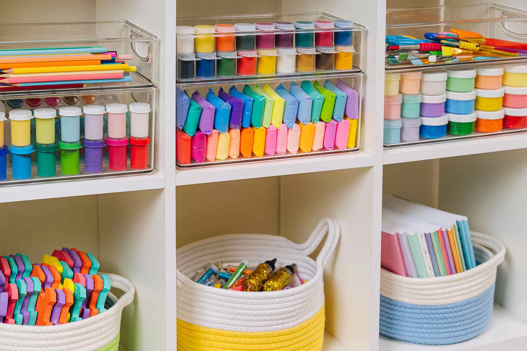 Classroom supplies for preschoolers in a storage rack